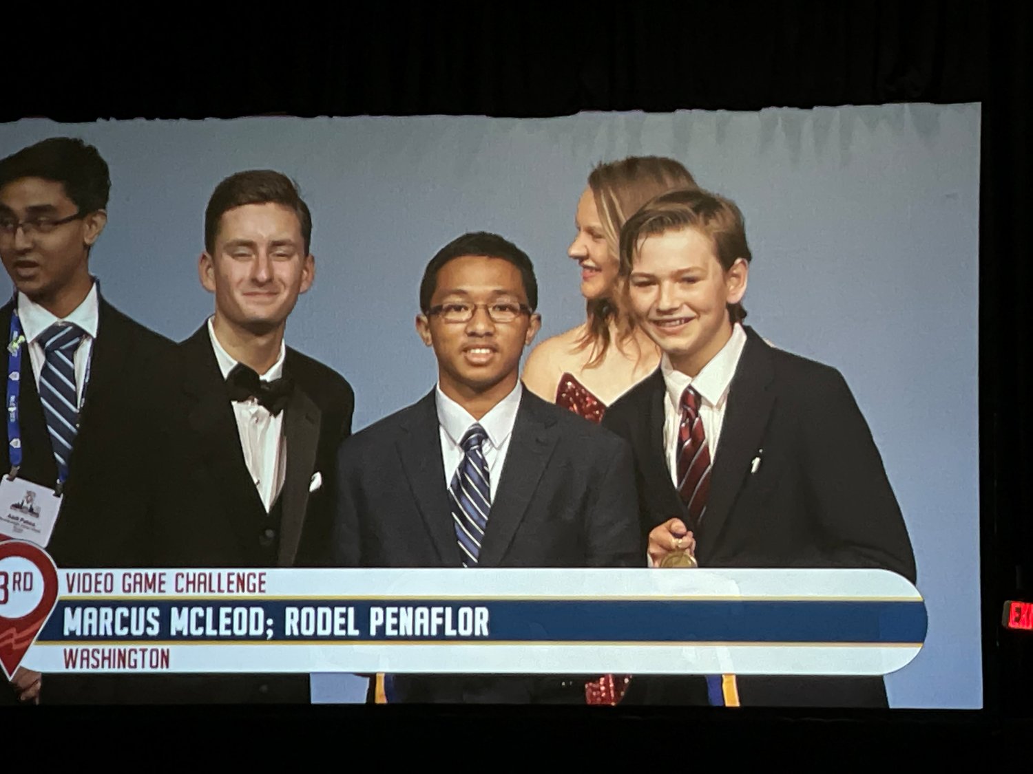 Komachin's Video Game Challenge contestants Marcus McLeod and Rodel Penaflor are shown on the projection screen at  the McCormick Place Convention Center in Chicago at the FBLA conference